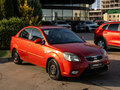 2010 Kia Rio II Рестайлинг, красный - вид 1