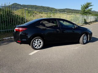 2016 Toyota Corolla XI (E160, E170, E180) Рестайлинг 1, чёрный, 1650000 рублей, вид 2