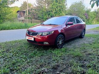 2010 Kia Cerato 5-speed II, красный, 750000 рублей, вид 1