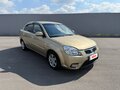 2011 Kia Rio II Рестайлинг, бежевый - вид 2