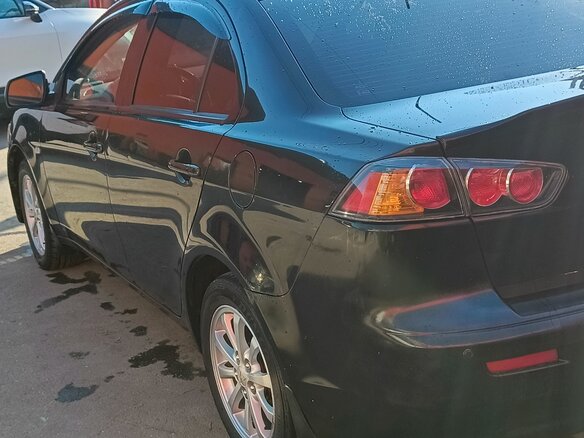 2010 Mitsubishi Lancer X, чёрный, 770000 рублей - вид 4