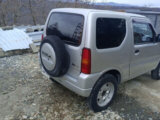 2011 Suzuki Jimny Kei car III Рестайлинг 1, серебристый, 1050000 рублей, вид 4