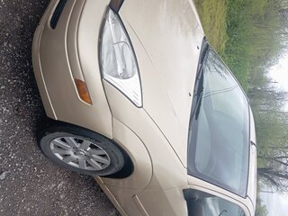 2001 Ford Focus I (North America), золотистый, 235000 рублей, вид 1