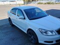 2011 Skoda Octavia II (A5) Рестайлинг, белый - вид 2