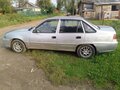 2012 Daewoo Nexia I Рестайлинг, серебристый, 145000 рублей - вид 4