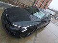 2024 Kia K5 III Рестайлинг, чёрный - вид 1