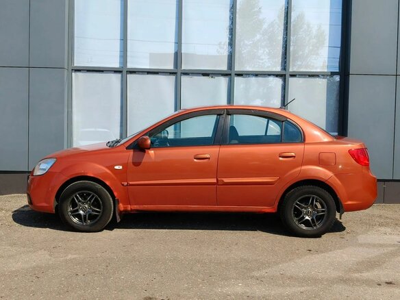 2010 Kia Rio II Рестайлинг, оранжевый - вид 4