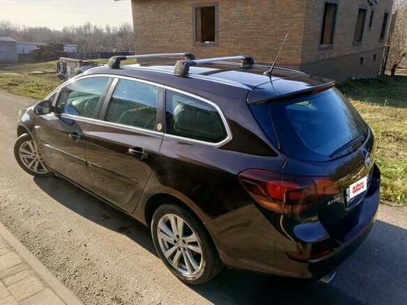 2012 Opel Astra J Рестайлинг, коричневый, 800000 рублей - вид 7