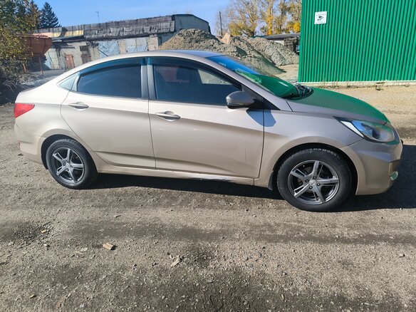 2011 Hyundai Solaris I, бежевый - вид 2