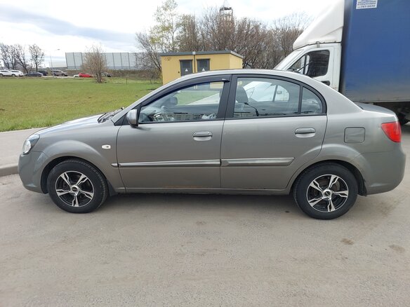 2011 Kia Rio II Рестайлинг, серый - вид 1