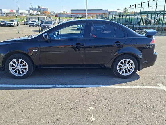 2010 Mitsubishi Lancer X, чёрный, 629000 рублей - вид 1