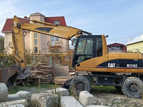 2006 Caterpillar M316, жёлтый, 6700000 рублей, вид 1