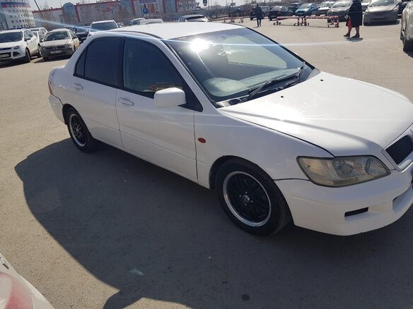 2000 Mitsubishi Lancer, белый - вид 2