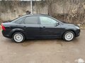 2010 Ford Focus II Рестайлинг, чёрный, 620000 рублей - вид 2