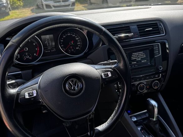 2017 Volkswagen Jetta VI Рестайлинг, коричневый, 1400000 рублей - вид 9