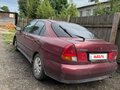 1998 Mitsubishi Carisma I, красный - вид 3