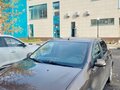 2021 Renault Logan Stepway II Рестайлинг, коричневый - вид 2