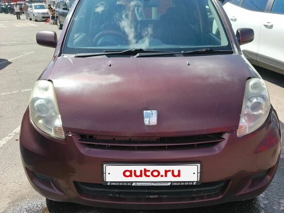 2009 Toyota Passo I (C10), красный - вид 1
