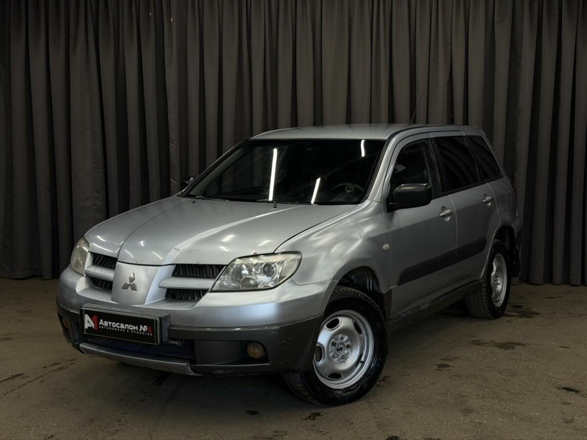 Открыть фотографии: Mitsubishi Outlander I