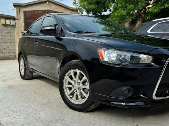 2012 Mitsubishi Lancer X Рестайлинг, чёрный, 750000 рублей - вид 4