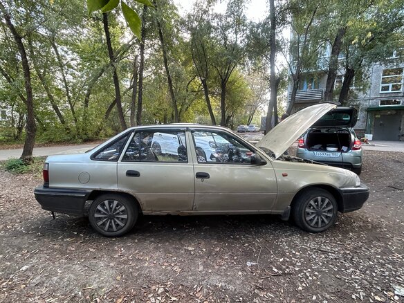 2005 Daewoo Nexia I, коричневый - вид 1