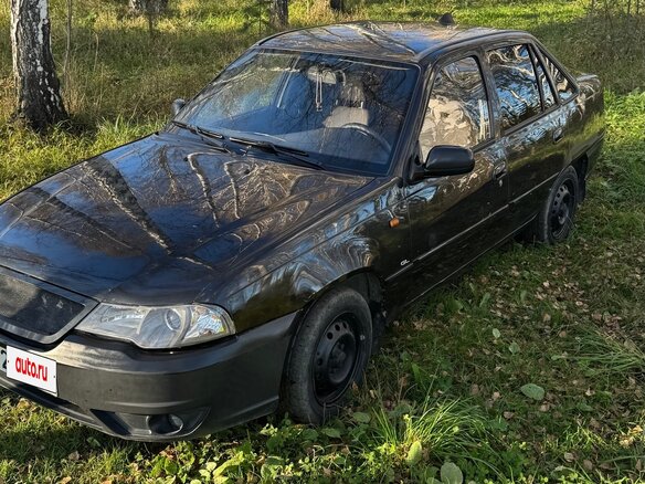 2011 Daewoo Nexia I Рестайлинг, чёрный - вид 1