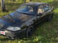 2011 Daewoo Nexia I Рестайлинг, чёрный - вид 1