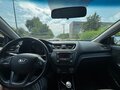 2013 Kia Rio 5-speed III, чёрный, 700000 рублей - вид 6