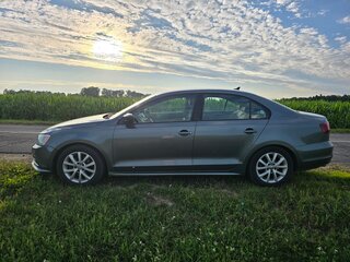2015 Volkswagen Jetta VI Рестайлинг, серый, 1050000 рублей, вид 5