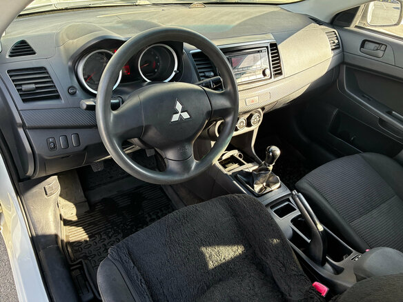 2007 Mitsubishi Lancer X, белый - вид 8