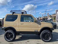 2016 Suzuki Jimny Kei car III Рестайлинг 2, коричневый - вид 1