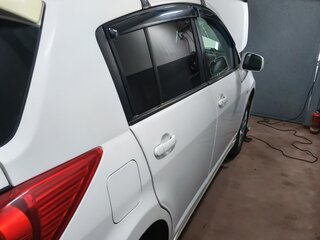 2010 Nissan Tiida I, белый, 700000 рублей, вид 2
