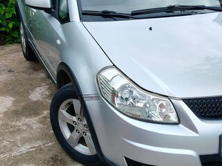 2010 Suzuki SX4 I (Classic) Рестайлинг, серебристый, 600000 рублей, вид 2
