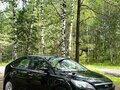 2010 Ford Focus II Рестайлинг, чёрный, 673000 рублей - вид 2