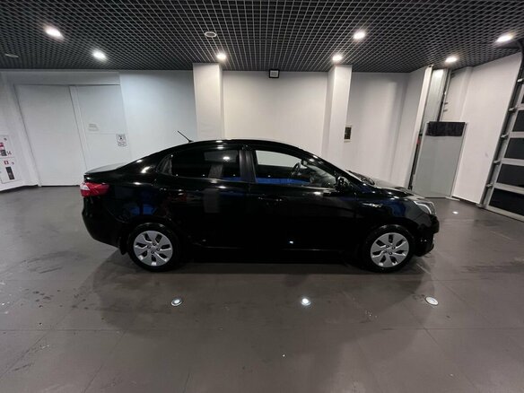 2012 Kia Rio 4-speed III, чёрный - вид 1