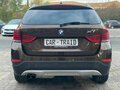 2014 BMW X1 20i I (E84) Рестайлинг, коричневый, 1400000 рублей - вид 5