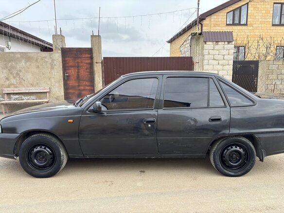 2012 Daewoo Nexia I Рестайлинг, чёрный, 150000 рублей - вид 1