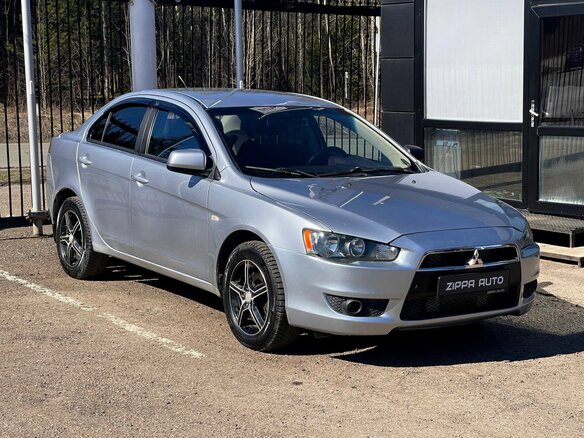 2011 Mitsubishi Lancer X Рестайлинг, серебристый, 629000 рублей - вид 1