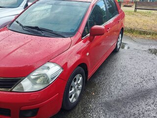2010 Nissan Tiida I, красный, 675000 рублей, вид 1