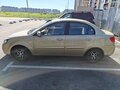 2010 Kia Rio II Рестайлинг, бежевый - вид 4