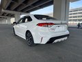 2025 Toyota Corolla Sporty XII (E210) Рестайлинг, белый - вид 1