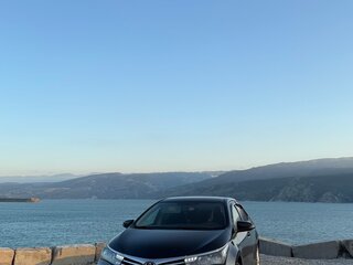 2014 Toyota Corolla XI (E160, E170, E180), чёрный, 1300000 рублей, вид 2