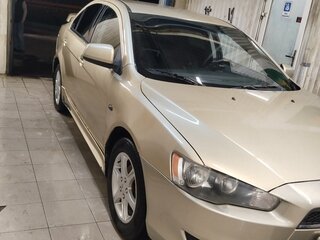 2010 Mitsubishi Lancer X, коричневый, 545000 рублей, вид 3