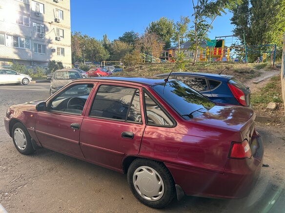 2010 Daewoo Nexia I Рестайлинг, красный - вид 3