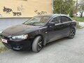 2007 Mitsubishi Lancer X, чёрный, 620000 рублей - вид 1