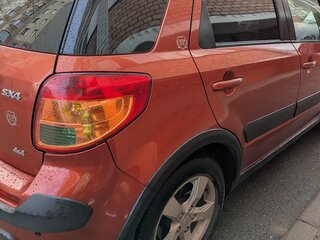 2010 Suzuki SX4 I (Classic) Рестайлинг, оранжевый, 883000 рублей, вид 2