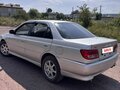1999 Toyota Carina VII (T210), серый - вид 2
