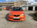 2002 Mazda Demio II (DY), оранжевый, 220000 рублей - вид 1