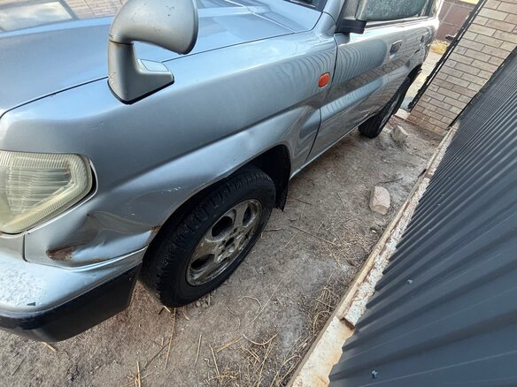 1999 Mitsubishi Pajero iO, серый - вид 3