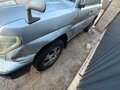 1999 Mitsubishi Pajero iO, серый - вид 3